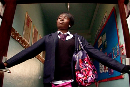 Black teen bursts through fire doors