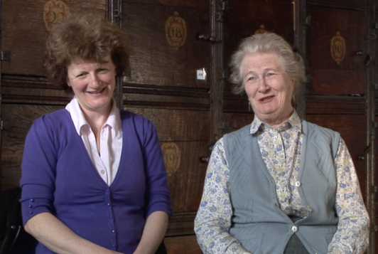 Two white females talk to camera